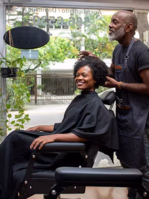 latino-hair-salon-owner-taking-care-client_23-2150286050